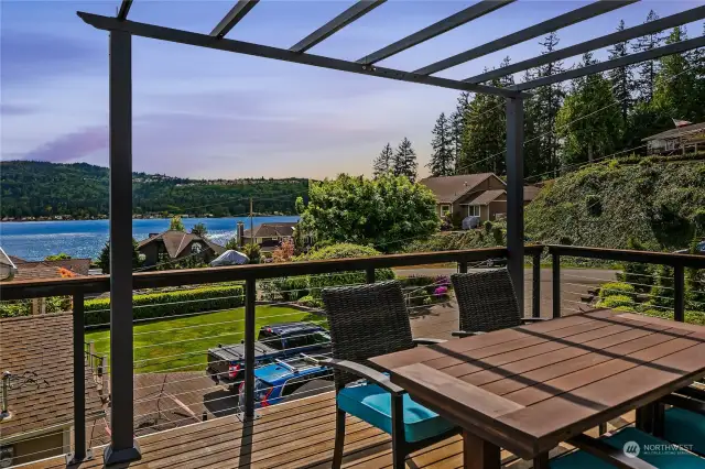 Step through the sliders off of the primary suite to a dedicated upper-level view deck, perfect for morning coffee, or watching evening sunsets.  The deck features a retractable cover.  A spiral staircase takes you to the main level deck.