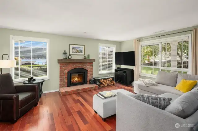 The family room features an outlook to westerly lake views, and an efficient wood burning brick fireplace insert.