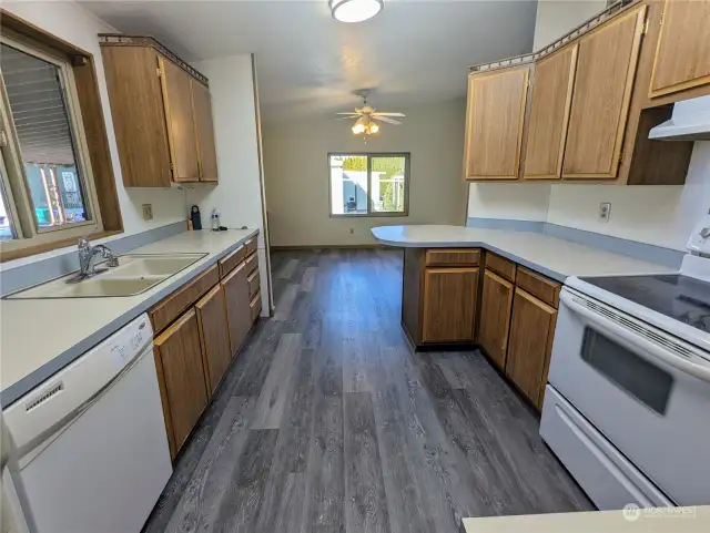 Large kitchen with lots of cabinet and countertop space.