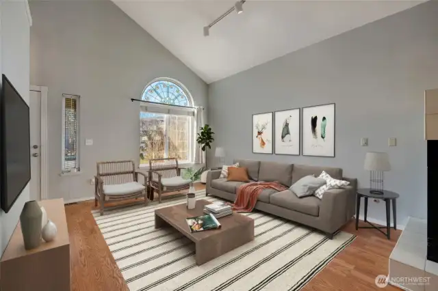 Open, spacious living room upon entry.