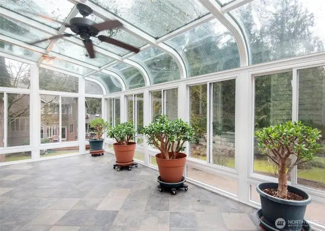 Sunroom off of the family room, leading onto a fabulous paver patio.