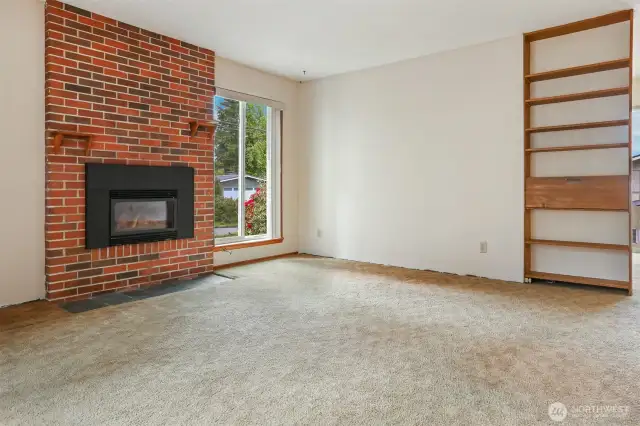 Newer gas fireplace and built-in desk.