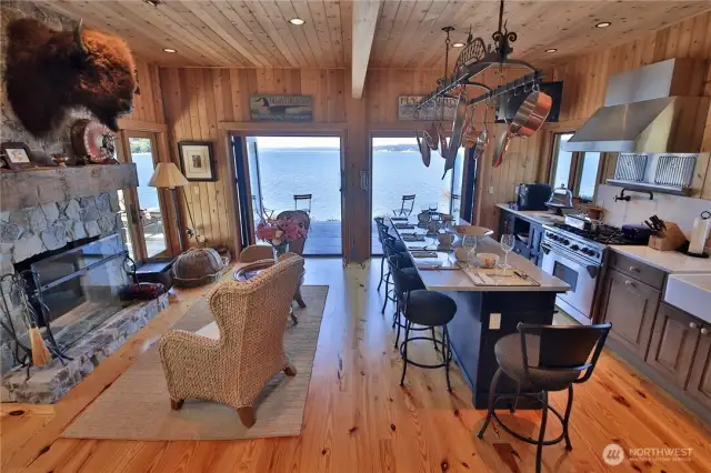Downstairs at beach house.  Wolf range and sub zero refrigerator along with Carrera marble in kitchen.  Nana doors.