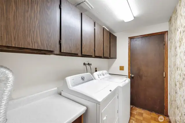 Laundry. Door leads to the 2 car garage