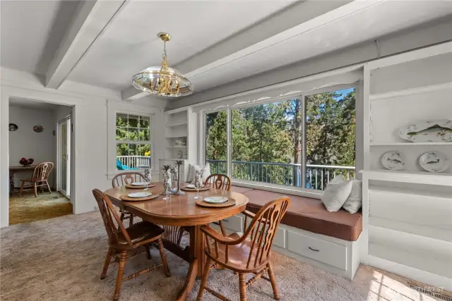 Generations of family members have enjoyed this dining area with it's built in storage under the window seat. No need to move away from the table after dinner - just lay down and start your post-meal nap!