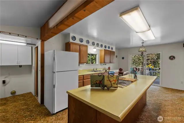 Washer & dryer hookups are just off the kitchen. Close enough to be convenient yet tucked away to be out of sight.