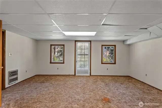 The family room has access to the lower yard. Did you notice the view?