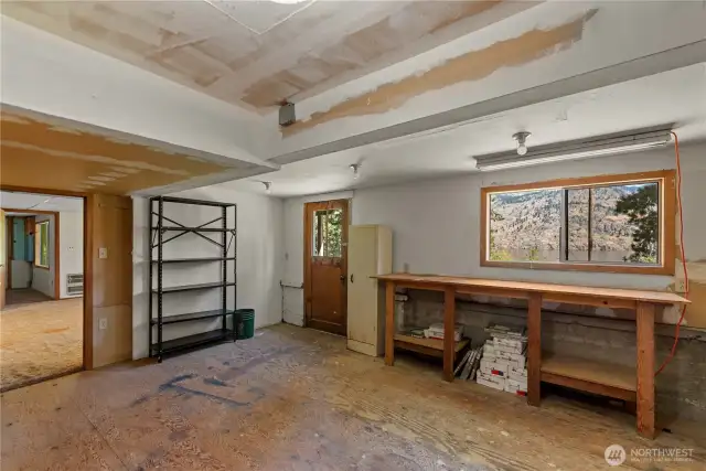 This room has been used as a workshop, with yet another exterior door for easy access.  Wouldn't this be a perfect space to become inspired by nature's beauty and create art in whatever medium suits you?