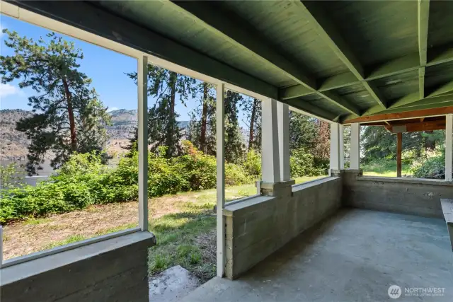 This covered patio, located just outside the lower level bedroom, nicely frames the views.