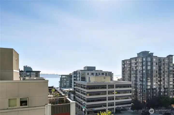 Sound & sunset views from your beautifully updated NW 2BR+Den corner home.