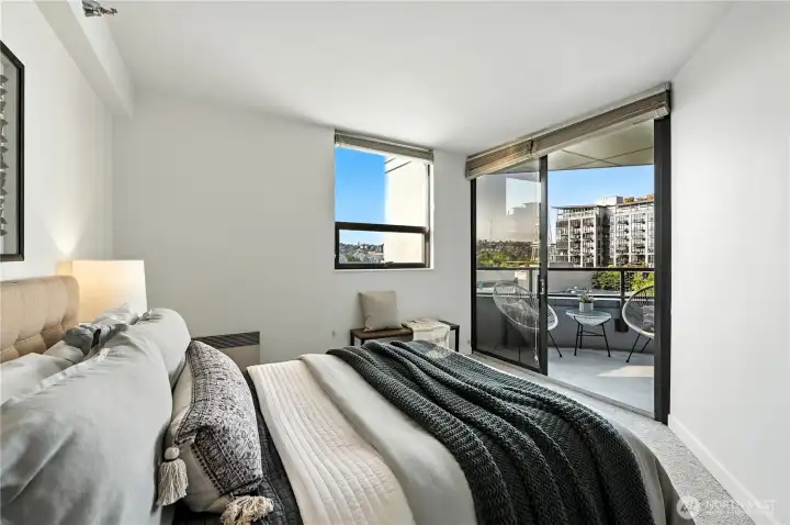 Nice guest bedroom also leads to the deck with views of the Space Needle!