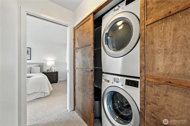 Laundry off the hallway with cool wood slider doors for a sophisticated & classy look!