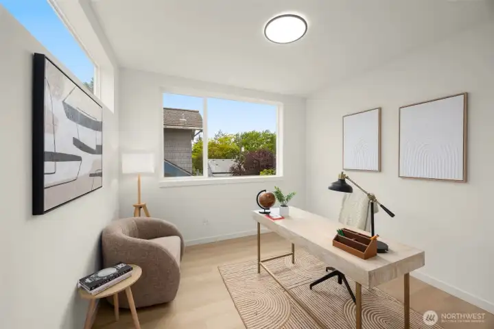 A quiet corner for creativity and focus, perfectly sized for a home office or art studio with a view.