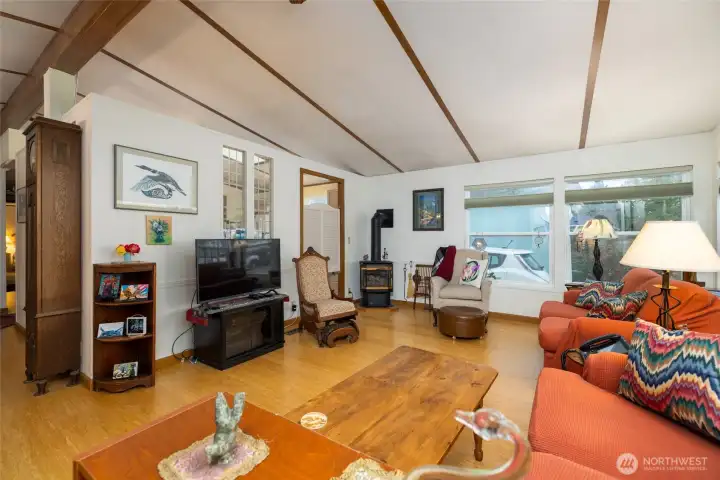 Large living room with comfortable warmth from the gas stove.