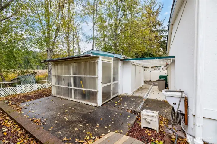 Backyard with shop and storage.