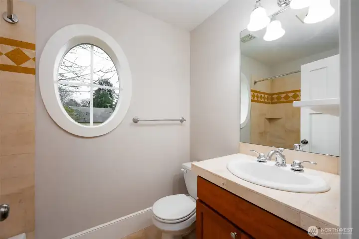 Main bathroom on second floor with window for natural light thoughtfully designed