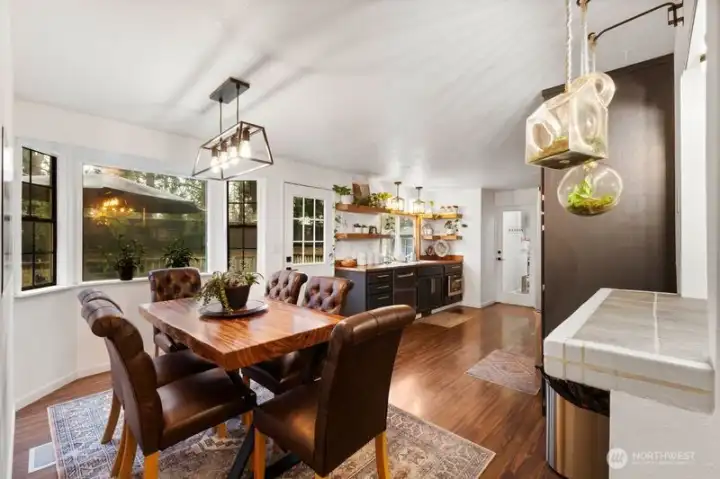 The dining room features a bay window and access to a large deck in the backyard.