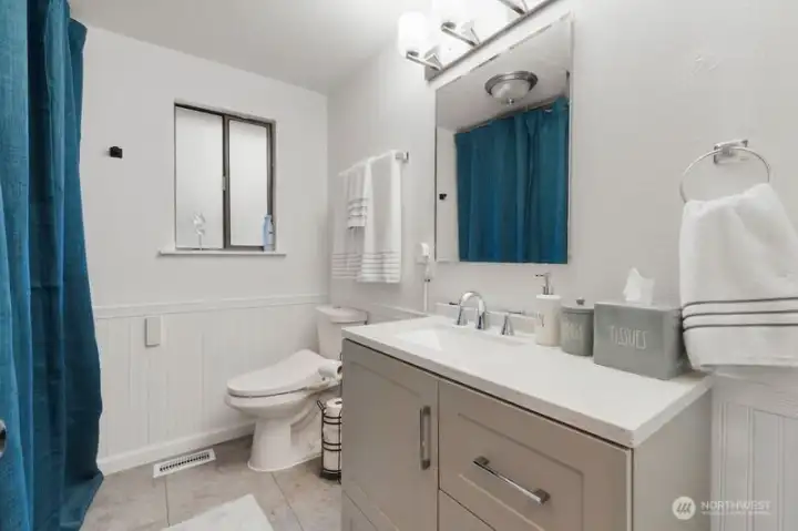 The main bathroom is easily accessible from the living room and main floor bedrooms.
