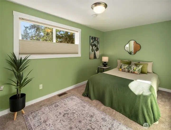 One of the main level bedrooms, this one south facing. Fresh carpet throughout.