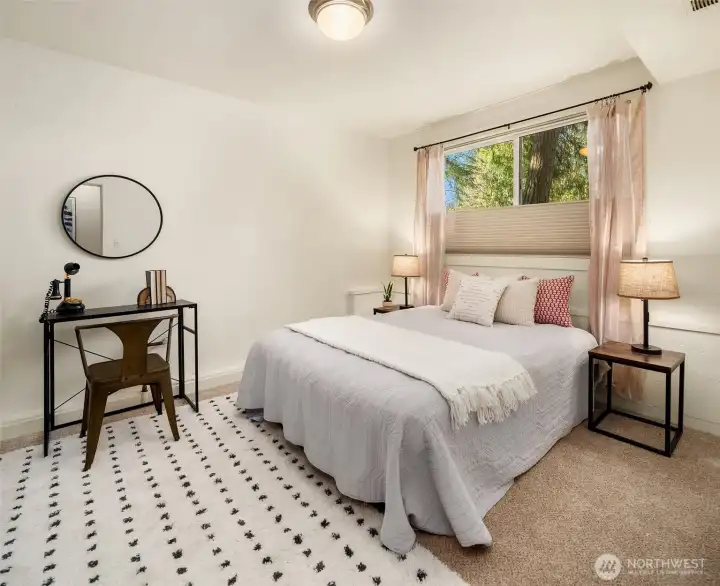 Another main floor bedroom faces west and has peak views of Sound and mountains.