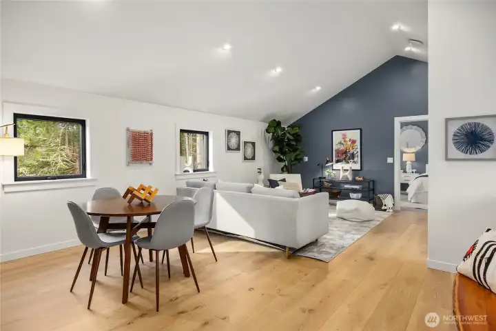 The upstairs layout includes two bedrooms, a loft rec room, full bath, a second office and walk-in linen closet.