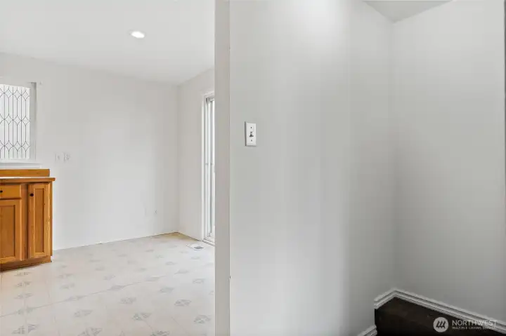 Entrance to kitchen from top of stairs. Great space for dining area.