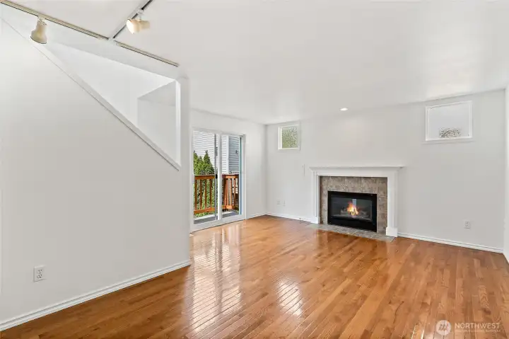 Deck off living room through sliding glass doors.