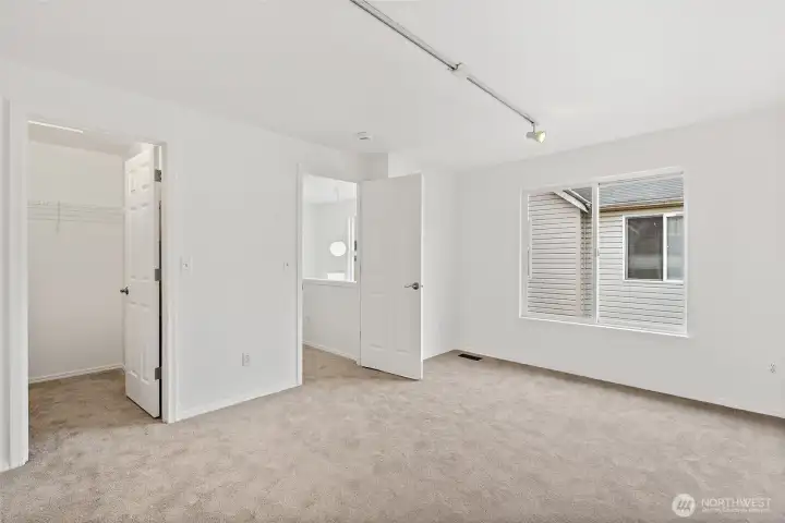 Primary bedroom with walk-in closet.