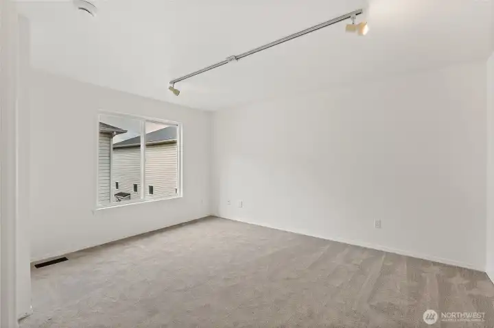 Large windows in primary bedroom.