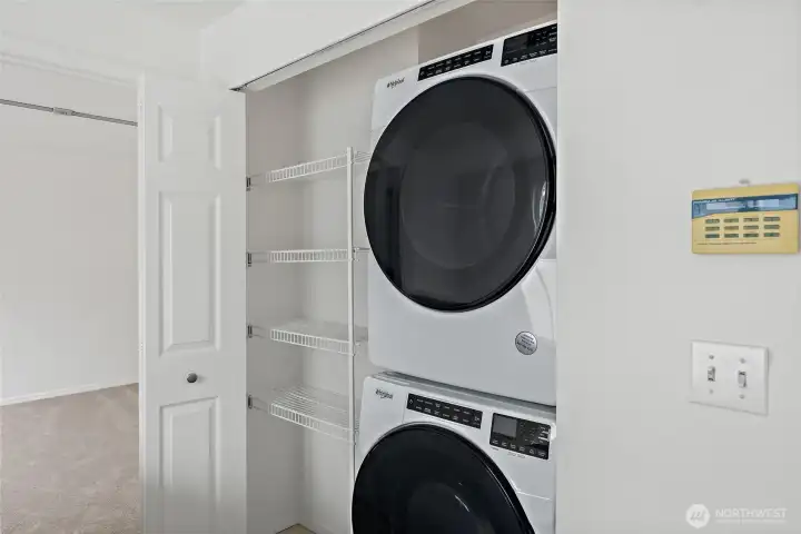 Large stacking washer and dryer (approx. 4 years old). Linen closet with built-in shelves.