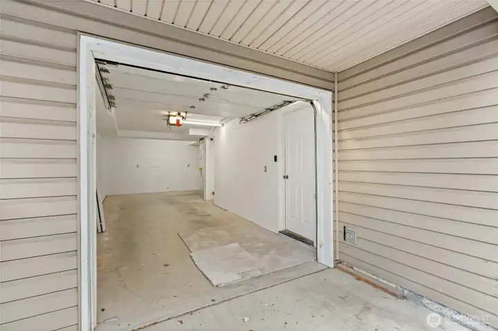 Single car garage, extra long providing additional space at back (and door to backyard off to back right). Also a generous under-stair storage area not shown. Door to right leads to home first level.