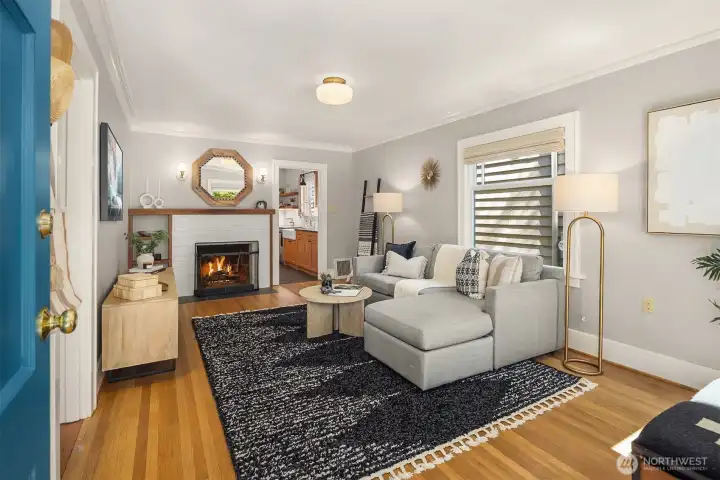 The living room is large, bright, and enjoys a gas fireplace.