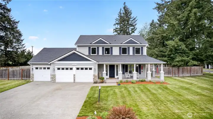 Close up view of the home showing the large lot and ample parking space.