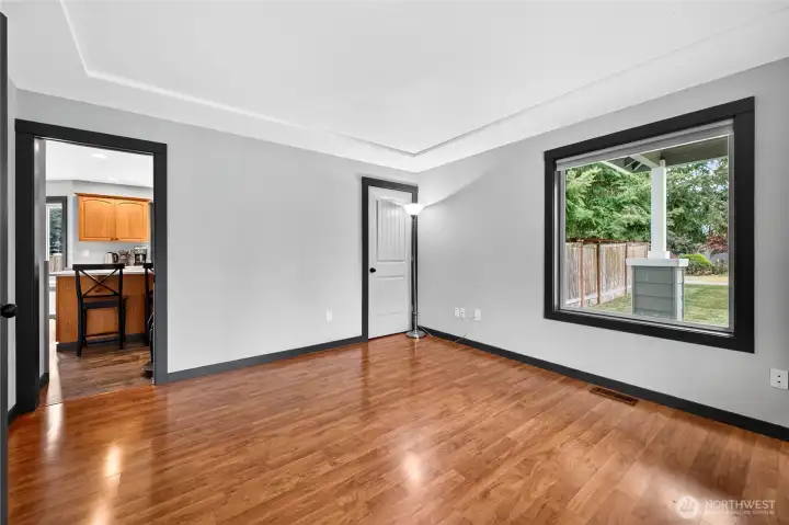 Versatile Den is located just off the kitchen and offers endless possibilities—perfect as a formal living room, dining room, playroom, or hobby space with convenient access to the main living areas.