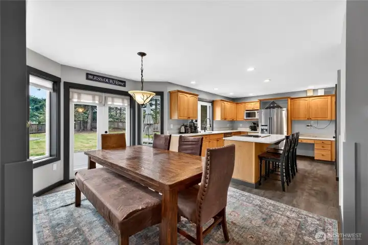 Additional view of the kitchen and dining area.