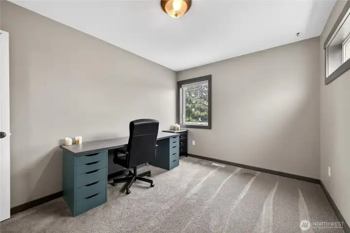 The fourth bedroom is located on the main floor and is Conveniently located off the living room.