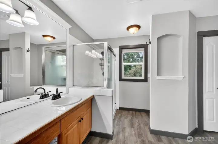 Additional view of the primary bathroom.