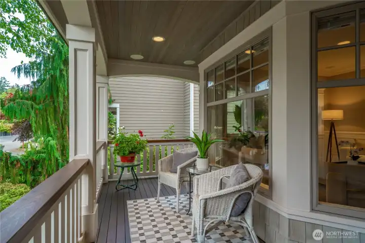Covered front porch welcomes you upon stepping up to this stunning home.