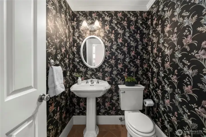 Half bathroom conveniently located on the main level for guests.