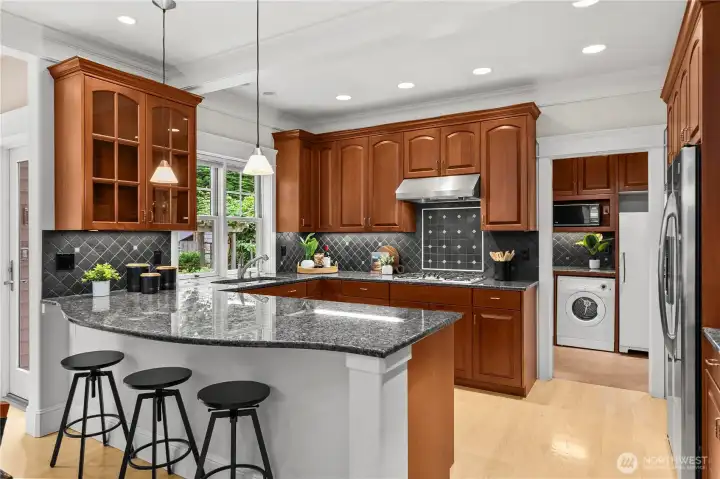 Kitchen includes stunning cabinetry and stainless steel appliances.
