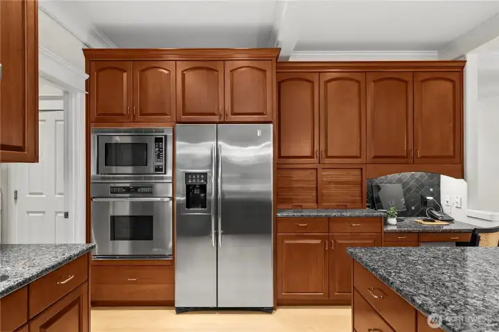 Thoughtfully designed kitchen has a built-in microwave and oven.