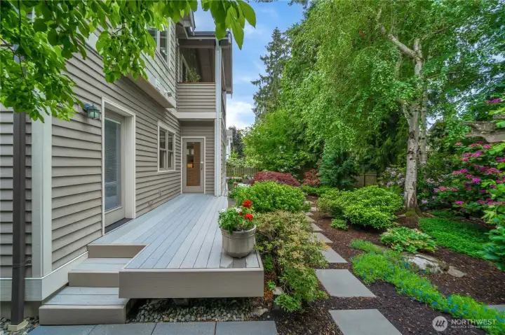 Enjoy your back deck and soak up summer time in this lush backyard!