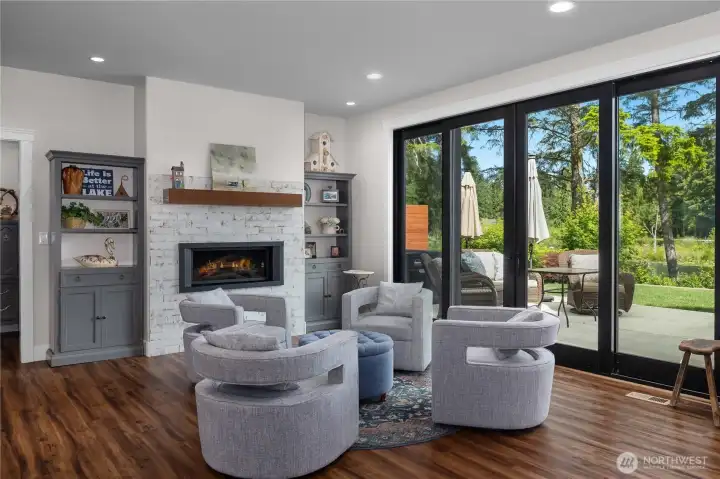Living room with custom sliding doors open right up to the outdoors.