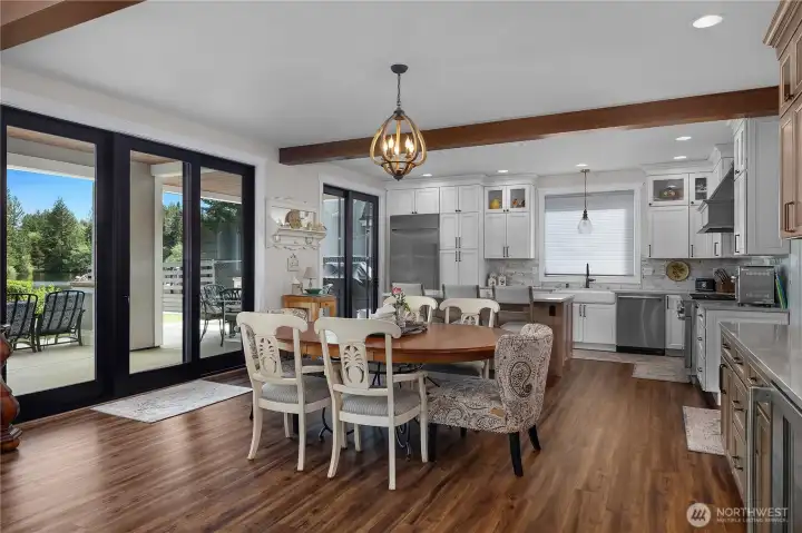 Dining room with a wetbar besides it.