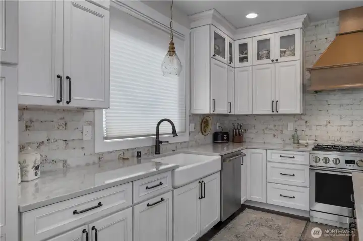 View of the kitchen with farm style sink.