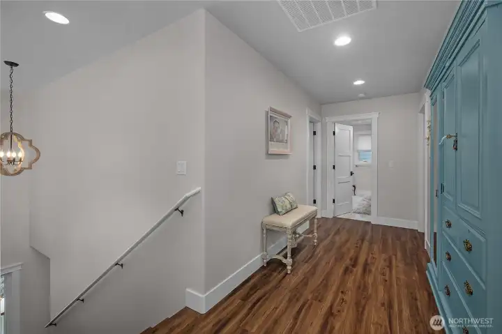 Stair landing with unique built-in cabinetry.