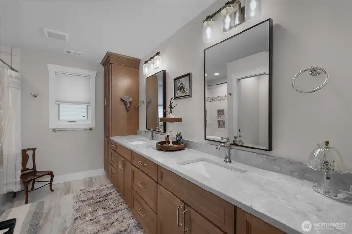 Full guest bath with double sinks.