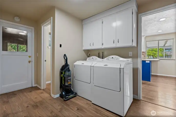 Laundry area with a 1/2 bath right off of it.