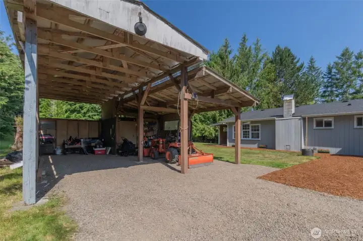 Covered carport area with workshop Covered carport area with workshop