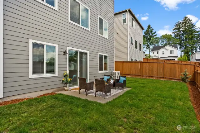 The patio off the lower level is surrounded by a fully fenced spacious backyard and offers the possibility of extending the patio if desired.